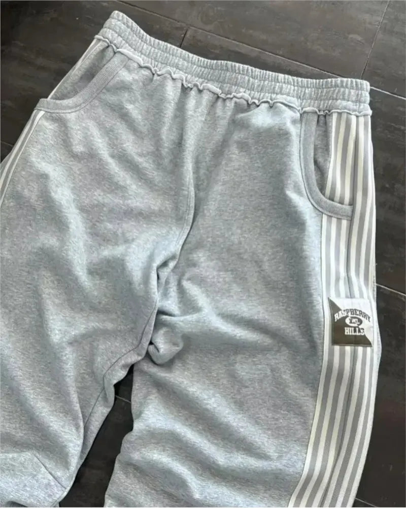 NOIZSY striped baggy pants with wide leg fit and bold pattern, casual streetwear style for comfortable, relaxed fashion.