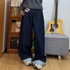 Drapey wide denim jeans from My Store with relaxed fit, showcasing light blue, distressed fabric and casual style.