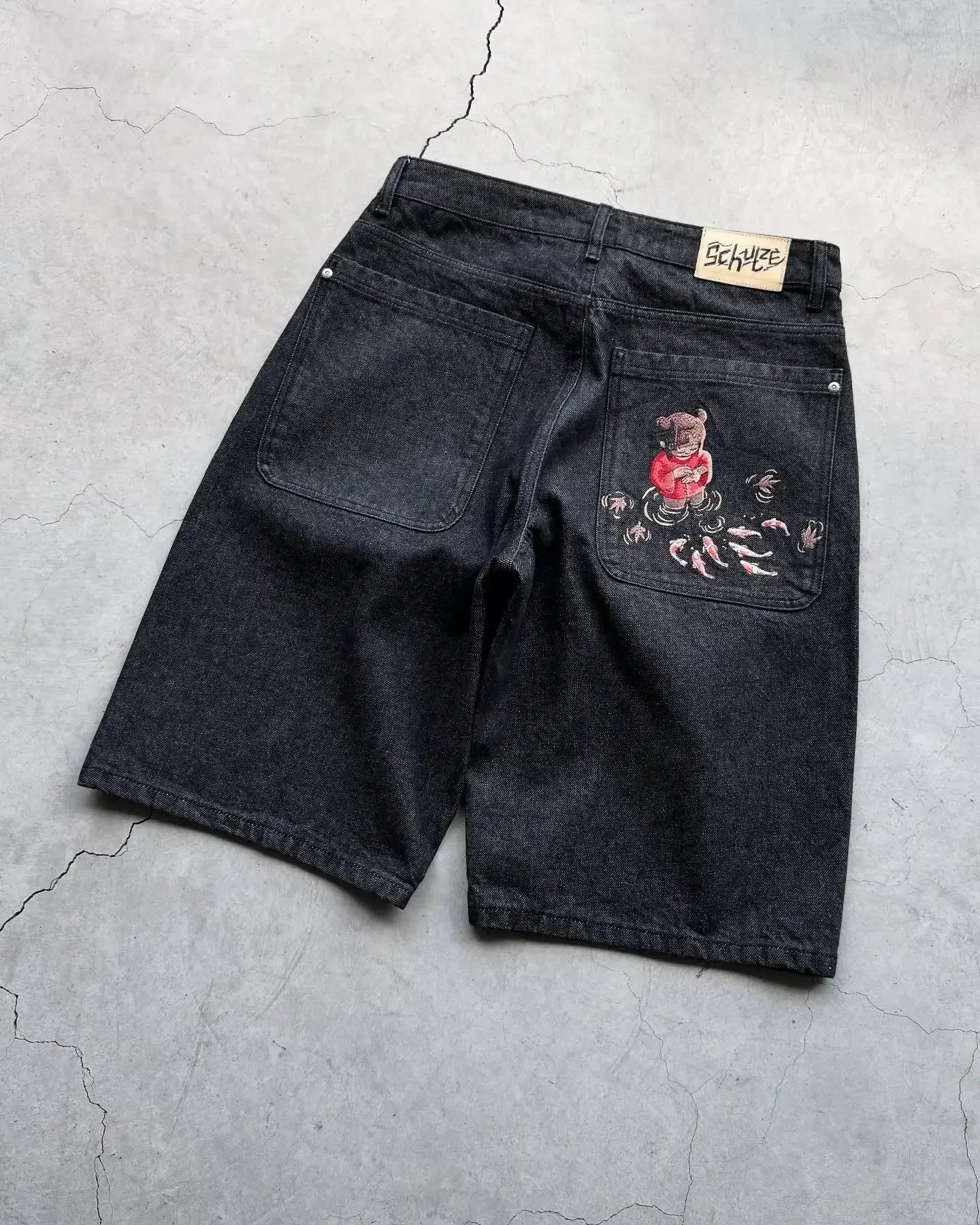 Vintage denim shorts with distressed details and rolled cuffs, styled with a casual summer look