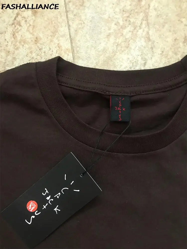 Cactus Jack T-shirt by My Store featuring a graphic print, white fabric, and casual fit, displayed on a hanger against a plain background.