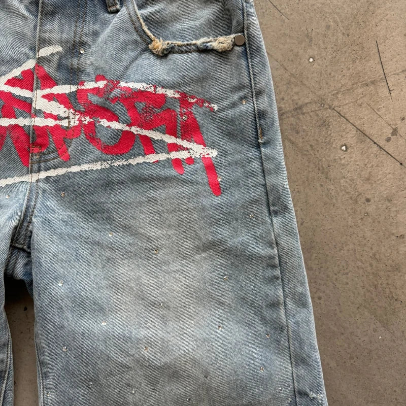 Y2K graffiti-style denim jorts from My Store, featuring colorful graffiti designs and distressed detailing.