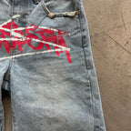 Y2K graffiti-style denim jorts from My Store, featuring colorful graffiti designs and distressed detailing.