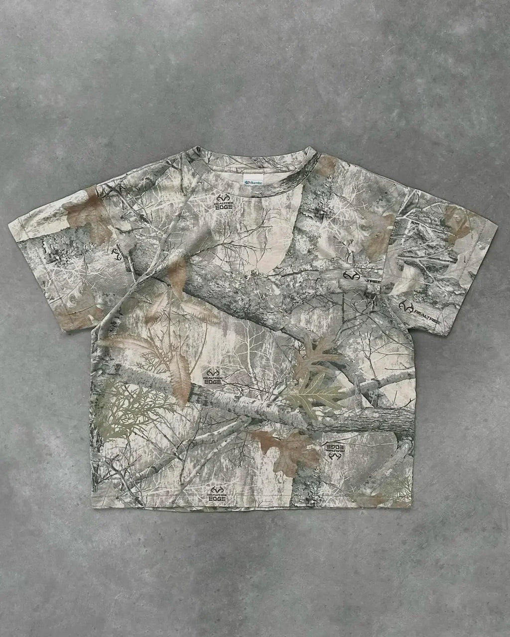 My Store camo T-shirt featuring a green and brown camouflage pattern, casual fit, and short sleeves.