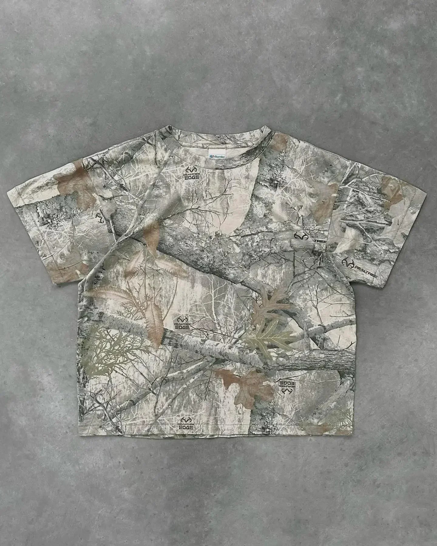 My Store camo T-shirt featuring a green and brown camouflage pattern, casual fit, and short sleeves.