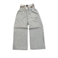 NOIZSY double waist baggy pants featuring a relaxed fit, shown in a neutral color with adjustable waistband and side pockets.