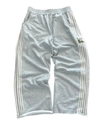 NOIZSY striped baggy pants with wide legs and casual fit, displayed on a hanger in a neutral setting.