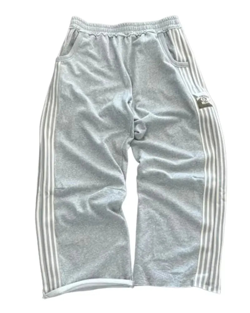 NOIZSY striped baggy pants with wide legs and casual fit, displayed on a hanger in a neutral setting.