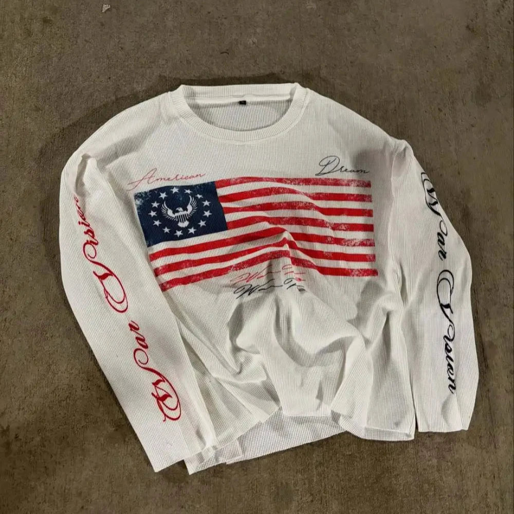 Black NOIZSY USA long sleeve shirt with USA flag graphic, fitted style, and crew neckline, displayed on a mannequin.