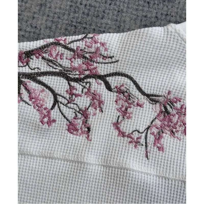 White cherry blossom t-shirt by Deeptown featuring a floral design, casual fit, and soft cotton fabric.