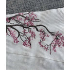 White cherry blossom t-shirt by Deeptown featuring a floral design, casual fit, and soft cotton fabric.