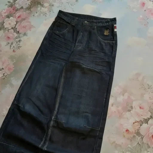 High waisted washed denim jeans from My Store, showing a close-up of the textured, faded fabric and classic five-pocket style.