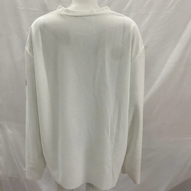 NOIZSY USA long sleeve shirt shown in a close-up, featuring a comfortable fit and classic design in neutral colors.