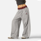 NOIZSY double waist red baggy pants with X design, showing the relaxed fit and vibrant color on a neutral background.