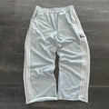 NOIZSY striped baggy pants featuring a relaxed fit with bold horizontal stripes and a comfortable, casual style.