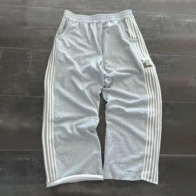 NOIZSY striped baggy pants featuring a relaxed fit with bold horizontal stripes and a comfortable, casual style.