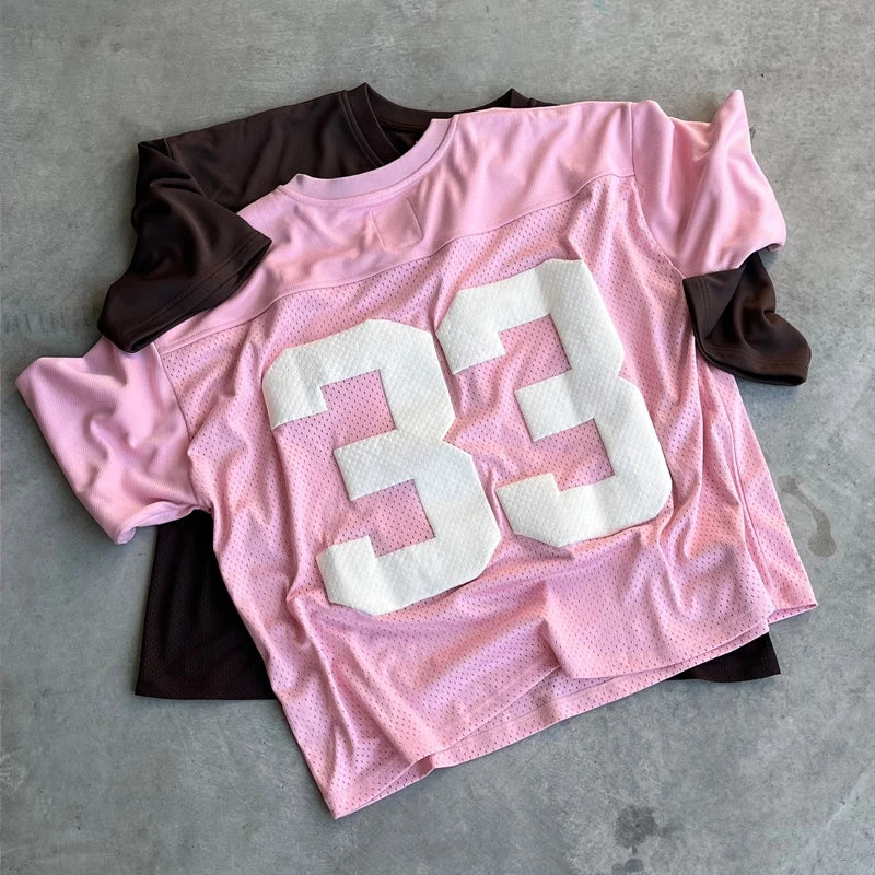 My Store 33 jerseys displayed on hangers, featuring various team colors and designs, ready for sports fans.