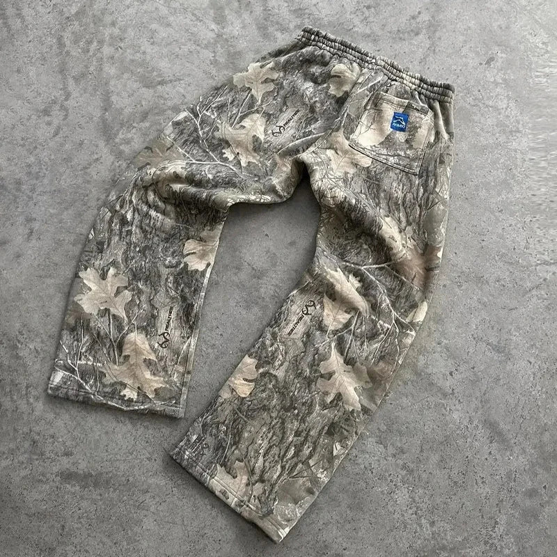 My Store camouflage pattern pants featuring a stylish camo design, showcasing the fabric and fit of the casual clothing item.