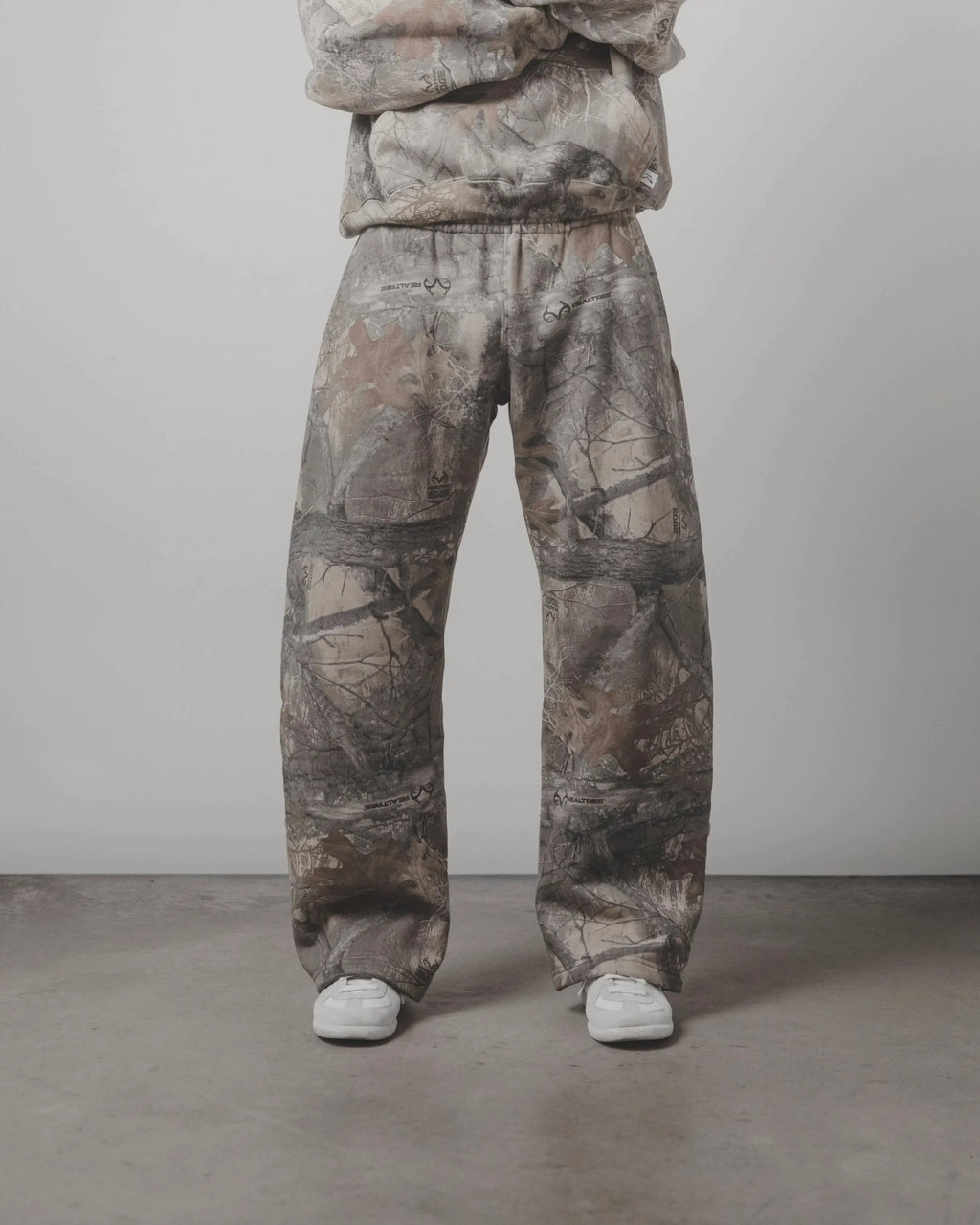 Camouflage pattern pants from My Store, featuring a relaxed fit and stylish design, shown in a close-up image.