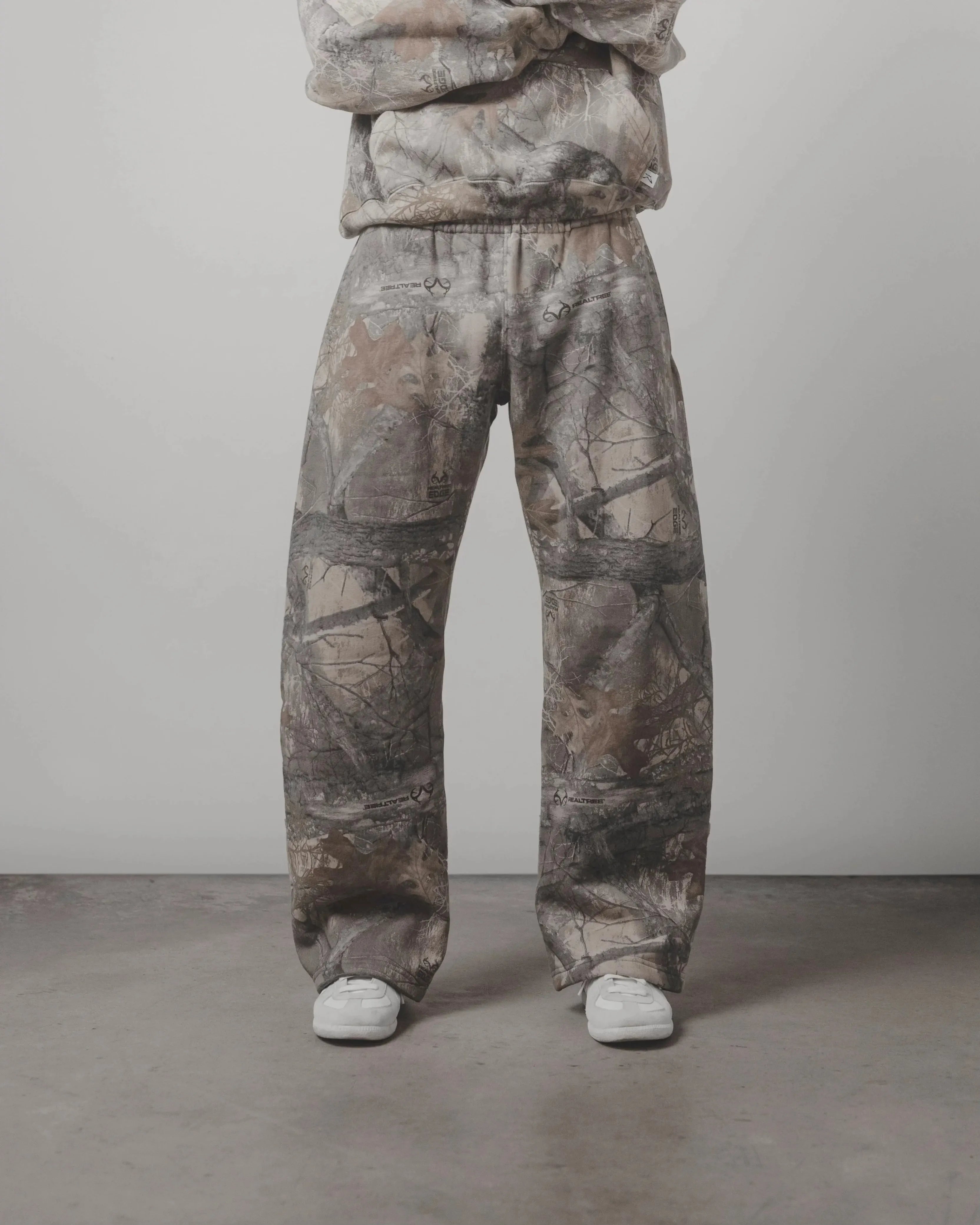 Camouflage pattern pants from My Store, featuring a relaxed fit and stylish design, shown in a close-up image.