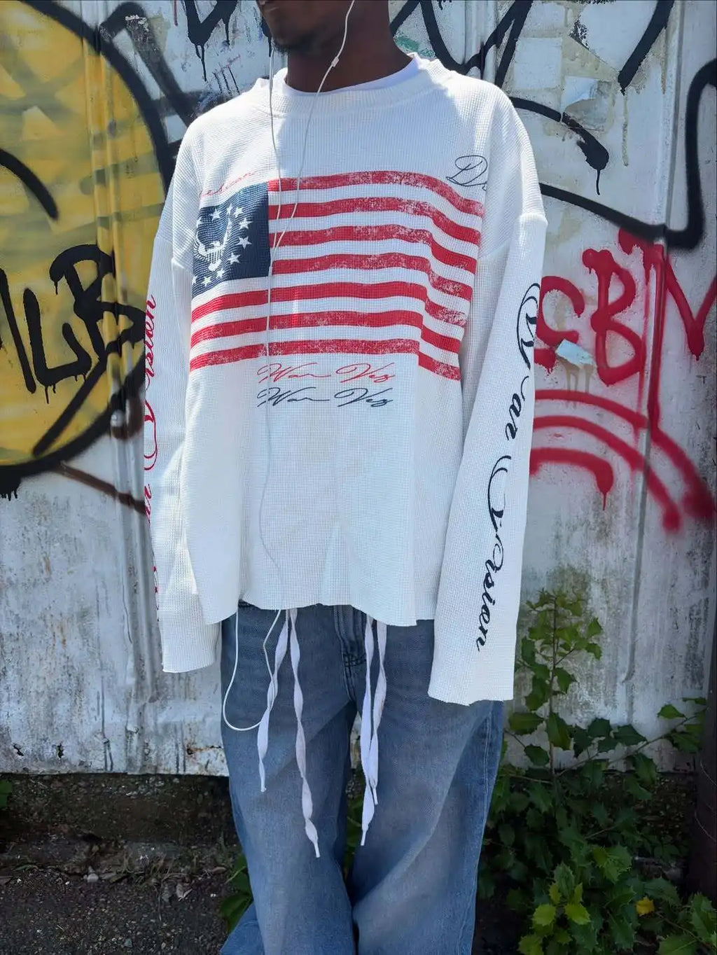 Black NOIZSY USA long sleeve shirt with crew neck and subtle logo detail, displayed flat on a white background.