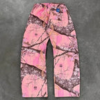 CamoPattern pants by My Store featuring a green and brown camouflage design, displayed on a hanger against a plain background.