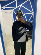 Lost Touch Sweater by My Store displayed on a hanger, featuring a soft knit fabric and a relaxed fit in a neutral color.