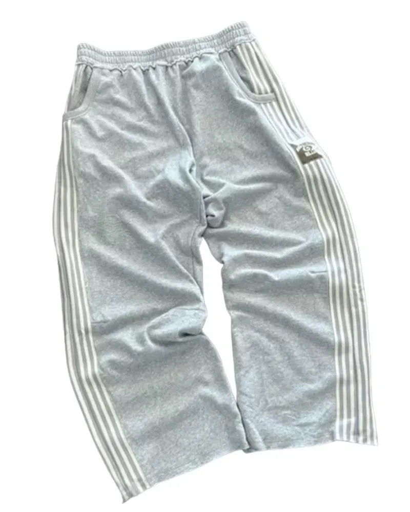 NOIZSY striped baggy pants with a relaxed fit, featuring bold vertical stripes and a comfortable, casual style.