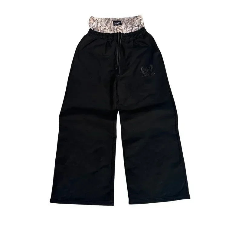 NOIZSY double waist baggy pants in black, featuring a relaxed fit with multiple pockets and casual style.